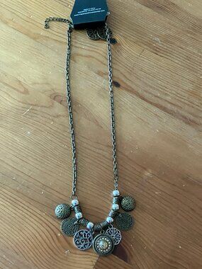 PAPARAZZI ACCESSORIES necklace set design in brass "To Coin A Phrase"